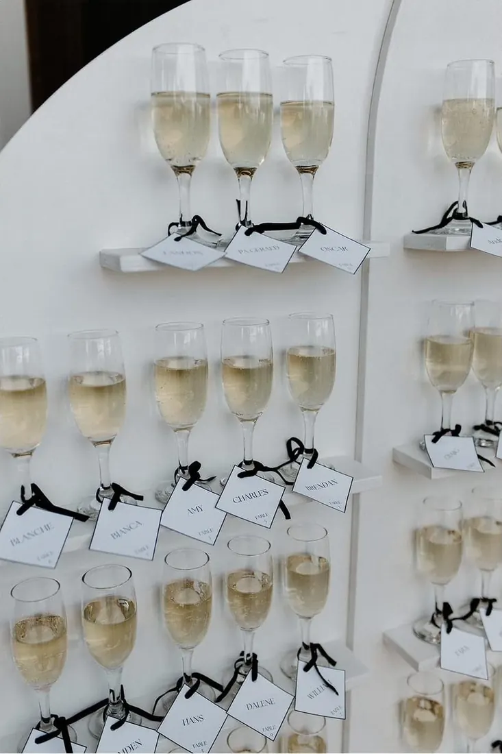 Champagne wall glasses with name tags
