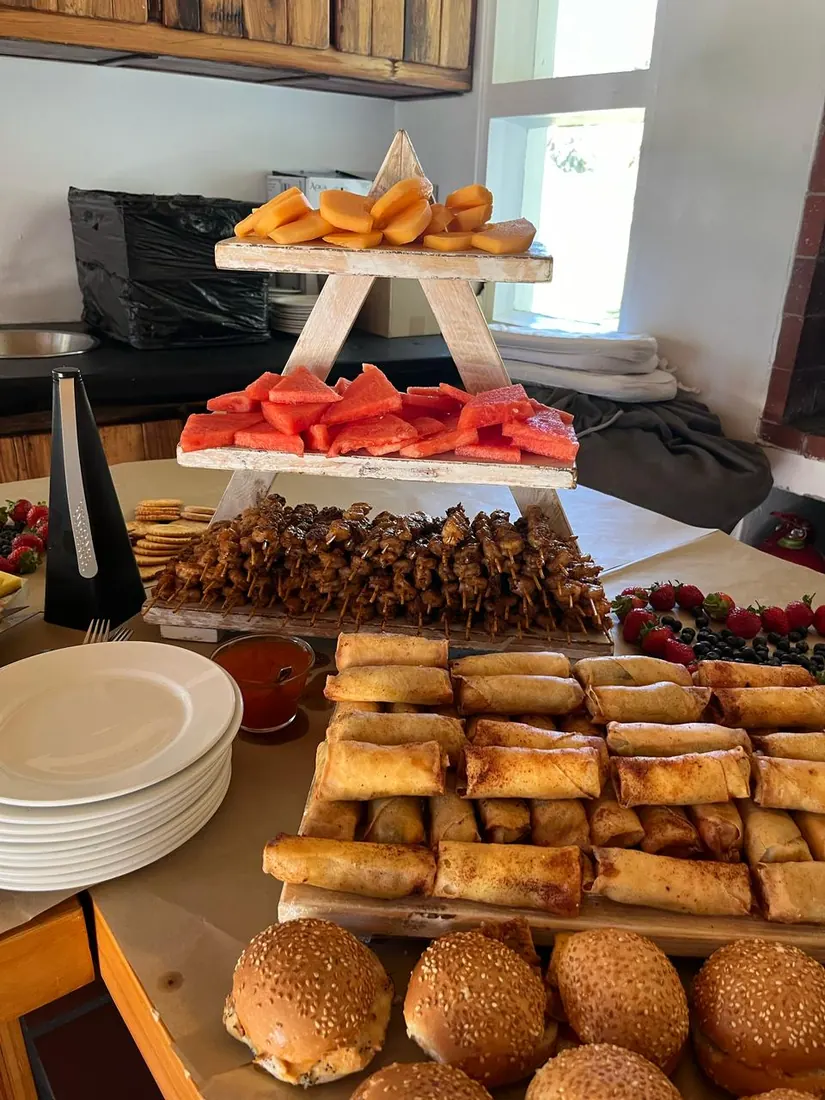 Wooden tiered food risers holding platters at an event