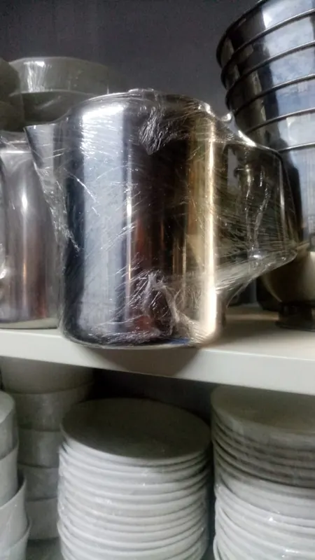 Stainless steel stock wrapped in cellophane on the shelf